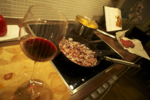 A glass of wine and cooking